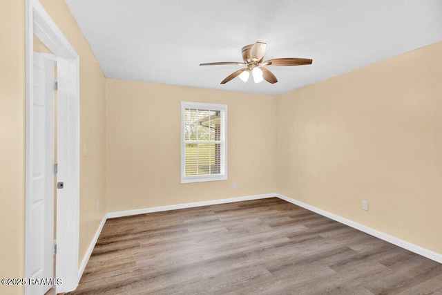 7848 Lake St, Lake Charles, LA 70605 - empty room with baseboards, a ceiling fan, and wood finished floors