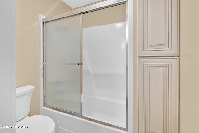 7848 Lake St, Lake Charles, LA 70605 - full bathroom featuring bath / shower combo with glass door and toilet