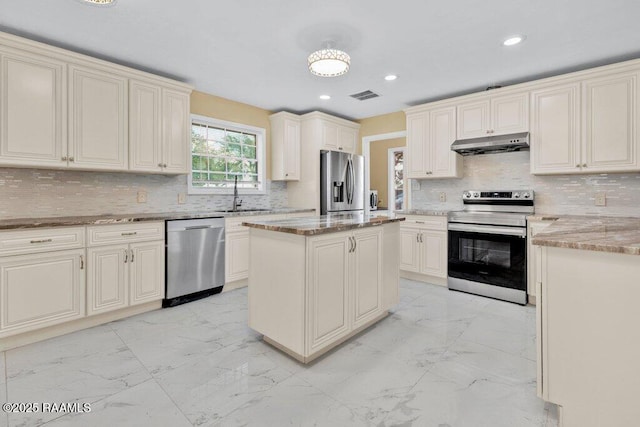 7848 Lake St, Lake Charles, LA 70605 - kitchen with visible vents, a sink, under cabinet range hood, stainless steel appliances, and marble finish floor