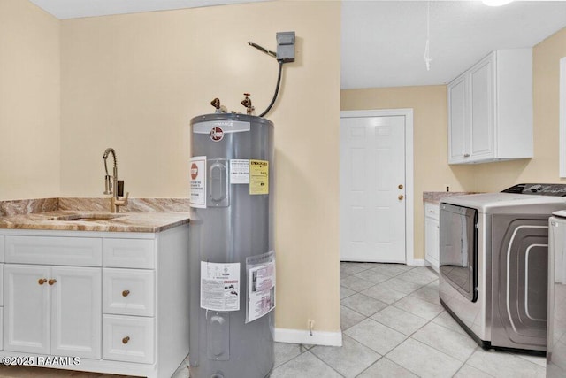 7848 Lake St, Lake Charles, LA 70605 - washroom with independent washer and dryer, water heater, a sink, baseboards, and cabinet space