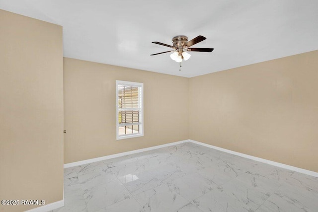 7848 Lake St, Lake Charles, LA 70605 - spare room with ceiling fan, marble finish floor, and baseboards