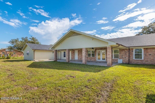 7848 Lake St, Lake Charles, LA 70605 - rear view of house featuring a yard, a ceiling fan, brick siding, and a patio