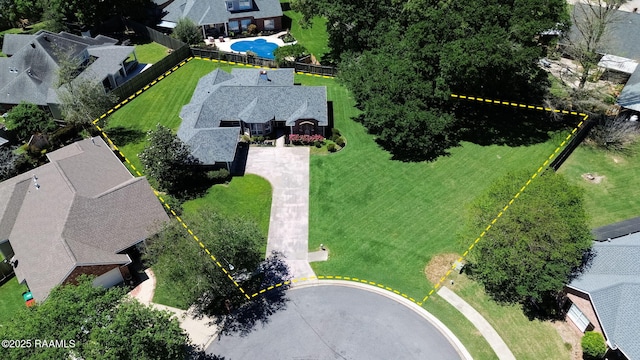 birds eye view of property with a residential view