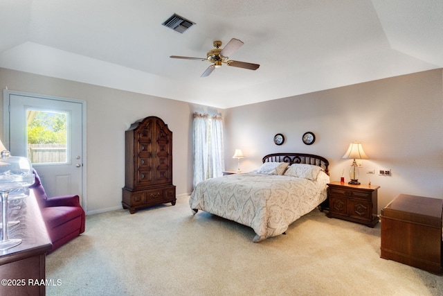 carpeted bedroom featuring visible vents and a ceiling fan