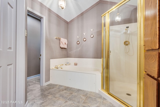 bathroom with a bath and a stall shower
