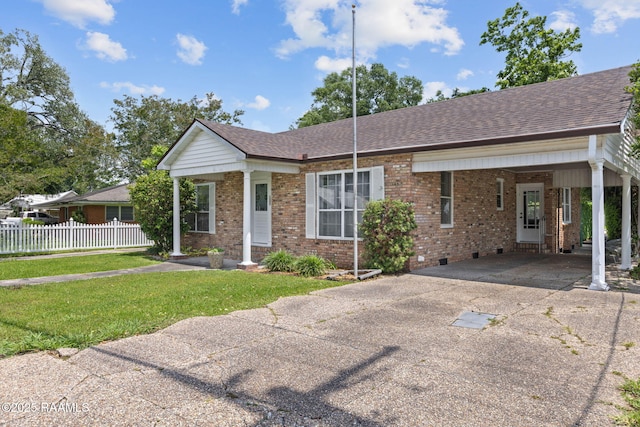 311 S Morgan Ave, Broussard, LA 70518 - ranch-style house with fence, a front lawn, a shingled roof, concrete driveway, and brick siding