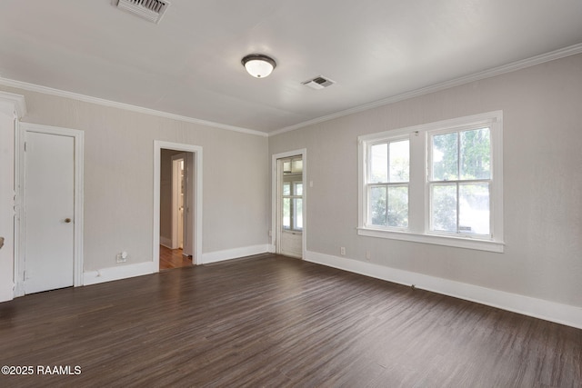 311 S Morgan Ave, Broussard, LA 70518 - spare room featuring baseboards, ornamental molding, visible vents, and dark wood-style floors
