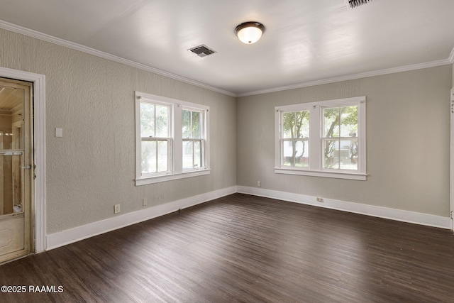 311 S Morgan Ave, Broussard, LA 70518 - spare room featuring a wealth of natural light, dark wood finished floors, and visible vents