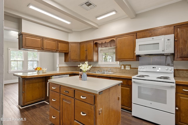 311 S Morgan Ave, Broussard, LA 70518 - kitchen featuring a sink, brown cabinetry, white appliances, dark wood-style flooring, and a kitchen island