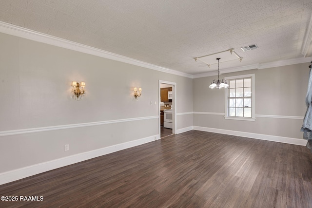 311 S Morgan Ave, Broussard, LA 70518 - interior space with a notable chandelier, crown molding, visible vents, baseboards, and dark wood-style floors