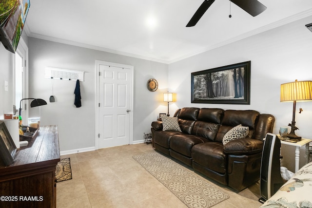 living area featuring ornamental molding, baseboards, a ceiling fan, and light tile patterned floors