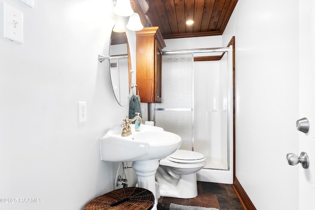 bathroom with baseboards, toilet, wood ceiling, a stall shower, and stone finish flooring
