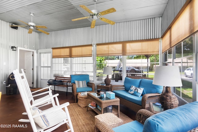 sunroom featuring an outdoor living space, a healthy amount of sunlight, and a ceiling fan