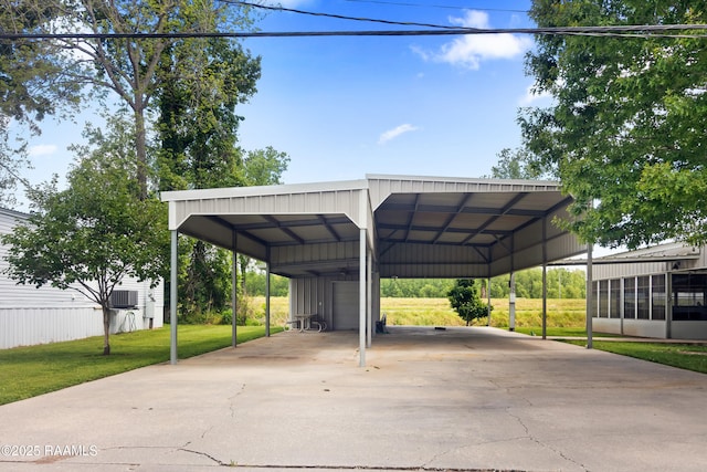 view of parking / parking lot featuring a detached garage