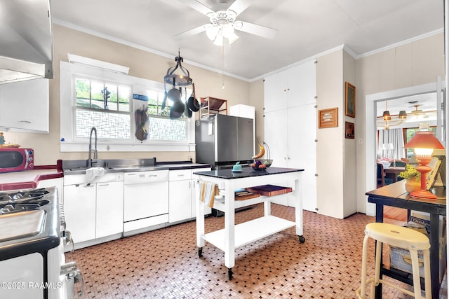 1703 W University Ave, Lafayette, LA 70506 - kitchen with stainless steel gas range oven, dishwasher, ceiling fan, and stainless steel countertops