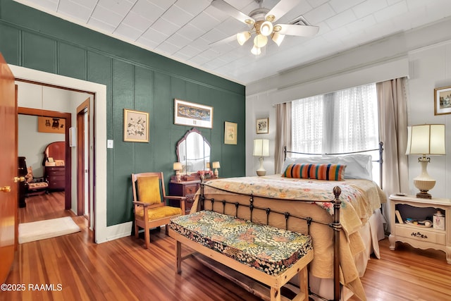 1703 W University Ave, Lafayette, LA 70506 - bedroom featuring ceiling fan and wood finished floors