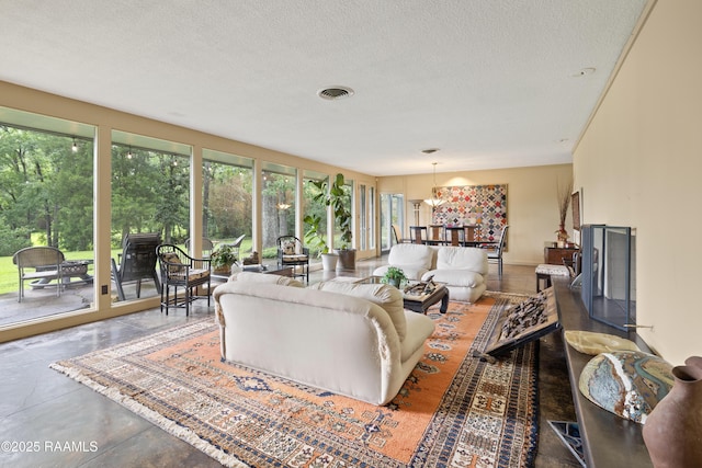 1 Eureka Plantation Rd, Lafayette, LA 70508 - living area featuring a textured ceiling and concrete floors