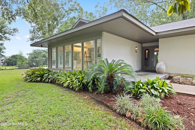 1 Eureka Plantation Rd, Lafayette, LA 70508 - doorway to property featuring a yard and stucco siding