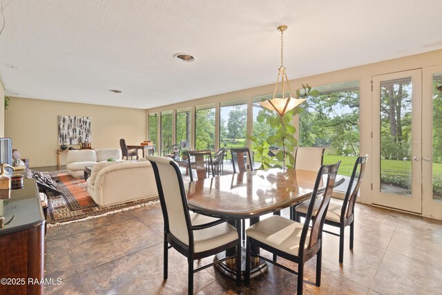 1 Eureka Plantation Rd, Lafayette, LA 70508 - dining area with healthy amount of natural light, light tile patterned floors, and french doors