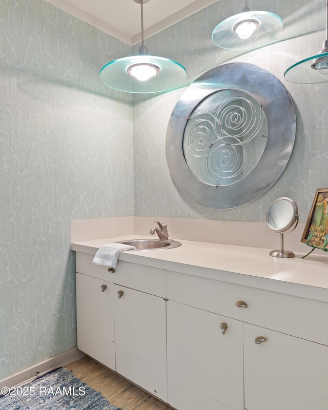 1 Eureka Plantation Rd, Lafayette, LA 70508 - bathroom featuring wood finished floors, vanity, and wallpapered walls