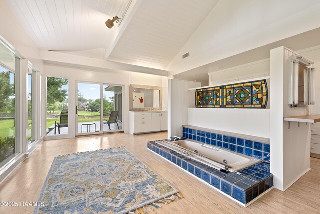 1 Eureka Plantation Rd, Lafayette, LA 70508 - full bath featuring vaulted ceiling, a whirlpool tub, wood finished floors, vanity, and wooden ceiling
