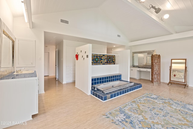 1 Eureka Plantation Rd, Lafayette, LA 70508 - living area featuring light wood-style floors, high vaulted ceiling, baseboards, and beamed ceiling