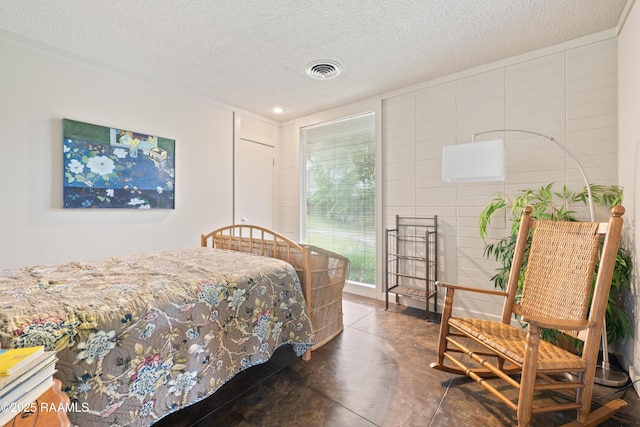 1 Eureka Plantation Rd, Lafayette, LA 70508 - bedroom featuring concrete floors, a textured ceiling, and tile walls