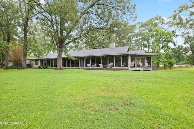 1 Eureka Plantation Rd, Lafayette, LA 70508 - rear view of house with a sunroom, a yard, and a chimney