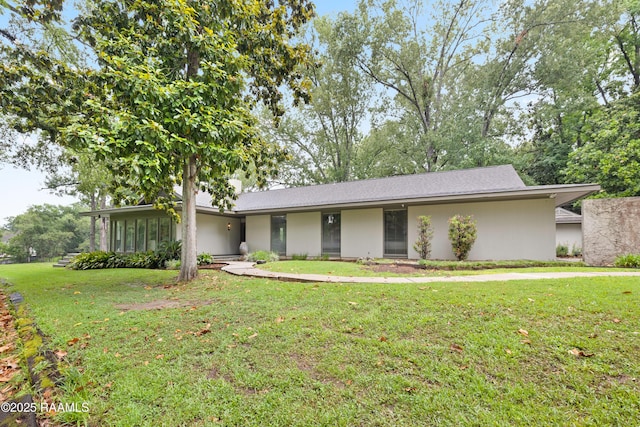 1 Eureka Plantation Rd, Lafayette, LA 70508 - view of front of home with a front yard and stucco siding