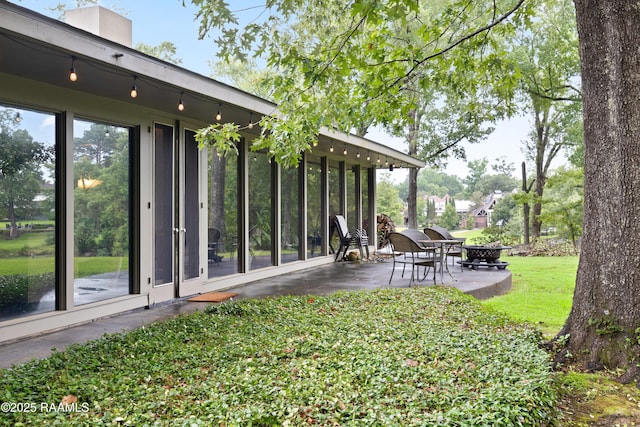 1 Eureka Plantation Rd, Lafayette, LA 70508 - view of grassy yard with a patio area and an outdoor fire pit