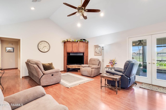 living room featuring visible vents, a ceiling fan, light wood finished floors, vaulted ceiling, and french doors