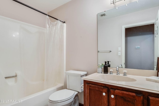 full bathroom featuring shower / tub combo, vanity, visible vents, and toilet