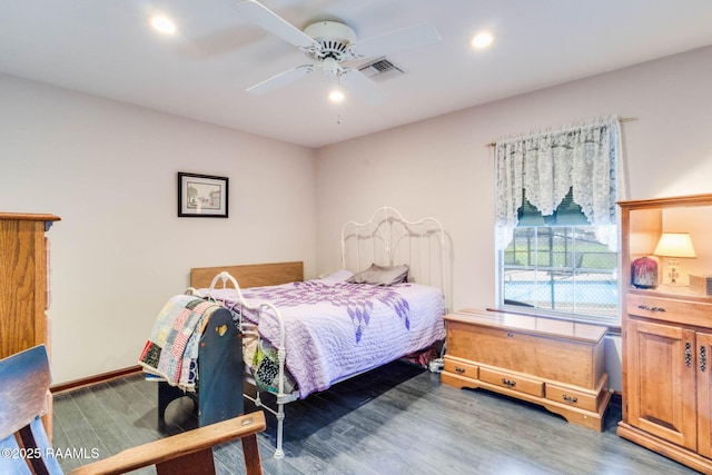 bedroom featuring a ceiling fan, visible vents, recessed lighting, wood finished floors, and baseboards
