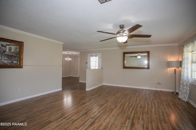 140 Saint Leo St, Opelousas, LA 70570 - spare room with crown molding, ceiling fan with notable chandelier, baseboards, and dark wood finished floors