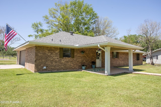 140 Saint Leo St, Opelousas, LA 70570 - view of front of house with brick siding, driveway, a front lawn, and a garage