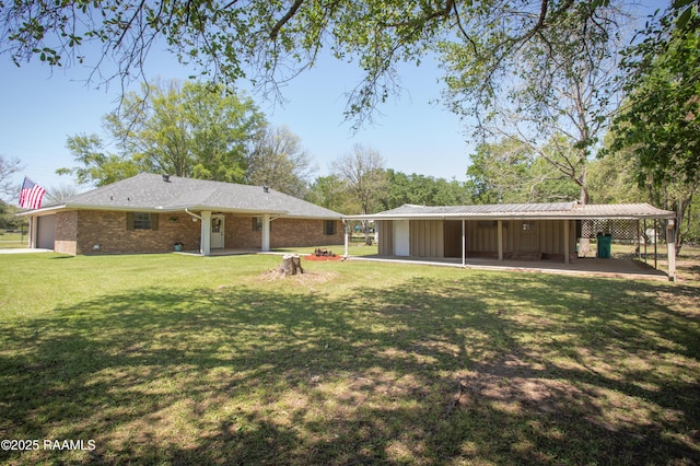 140 Saint Leo St, Opelousas, LA 70570 - rear view of property with brick siding and a lawn