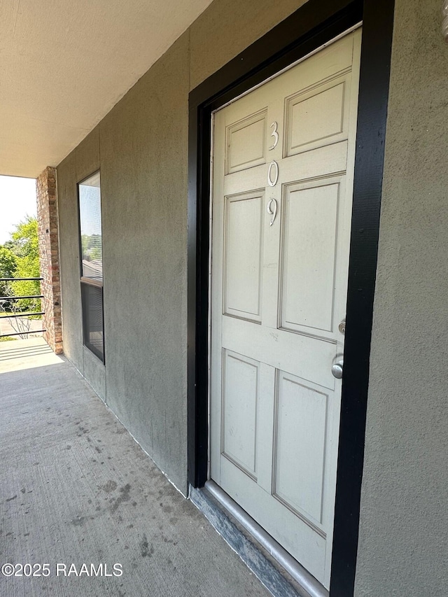 701 S College Rd Apt 309, Lafayette, LA 70503 - property entrance featuring stucco siding