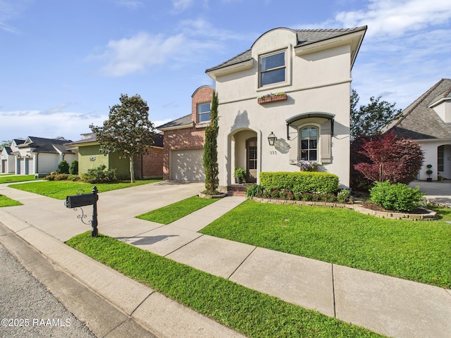 111 Croft Row, Lafayette, LA 70503 - view of front facade featuring stucco siding, concrete driveway, and a front yard