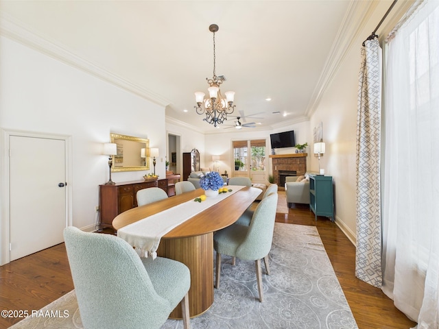 111 Croft Row, Lafayette, LA 70503 - dining area featuring crown molding, recessed lighting, a brick fireplace, and a notable chandelier