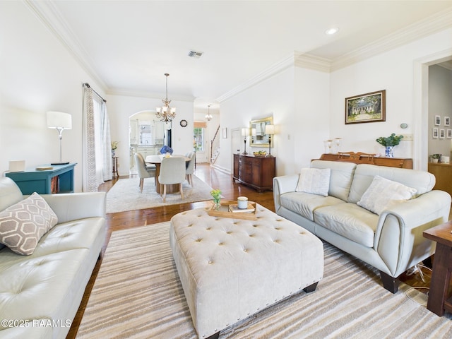 111 Croft Row, Lafayette, LA 70503 - living room featuring crown molding, visible vents, wood finished floors, and a chandelier