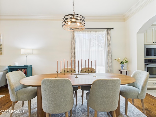 111 Croft Row, Lafayette, LA 70503 - dining space with arched walkways, crown molding, and wood finished floors