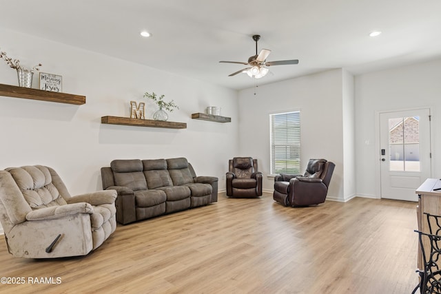 living room featuring recessed lighting, light wood finished floors, and a ceiling fan