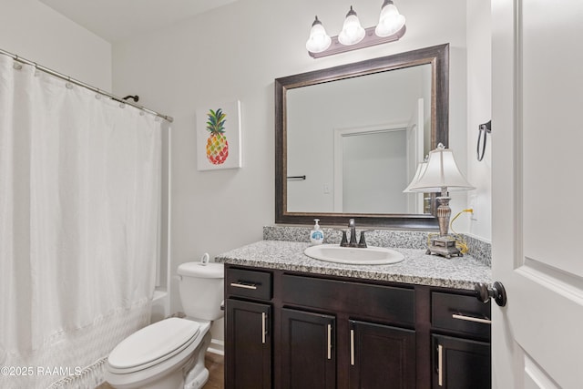 bathroom with toilet, shower / bath combo, and vanity