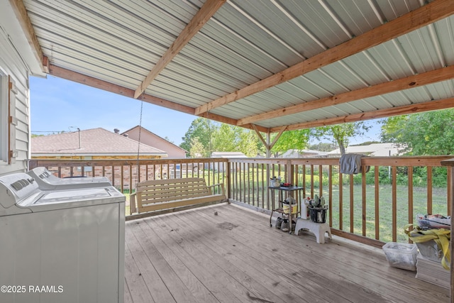 wooden terrace featuring independent washer and dryer
