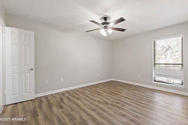 701 S College Rd Unit 303, Lafayette, LA 70503 - unfurnished room with baseboards, a ceiling fan, and wood finished floors