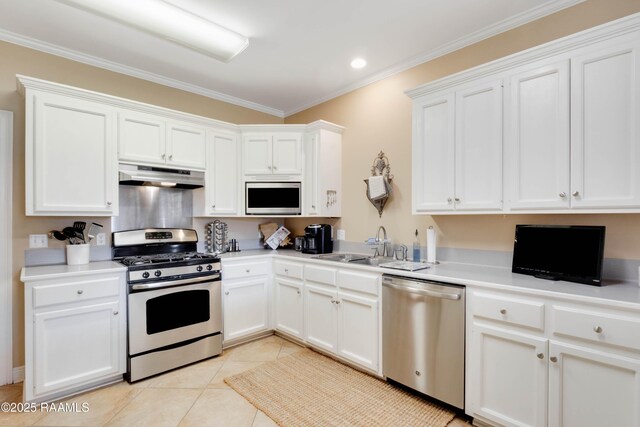 202 N Anita St, Lafayette, LA 70501 - kitchen featuring under cabinet range hood, white cabinets, and appliances with stainless steel finishes