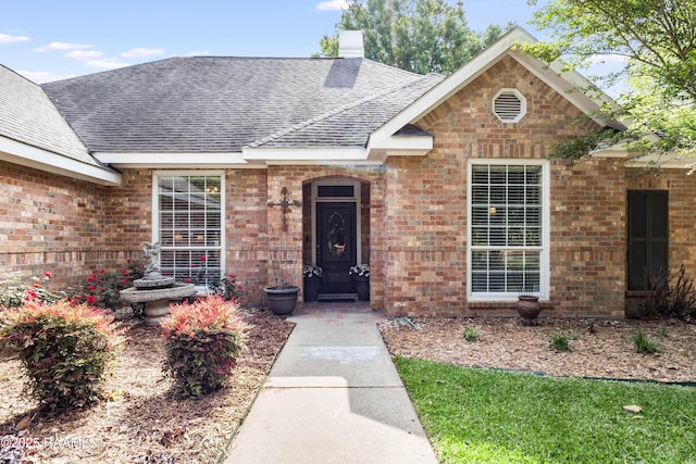 202 N Anita St, Lafayette, LA 70501 - entrance to property with a shingled roof, a chimney, and brick siding