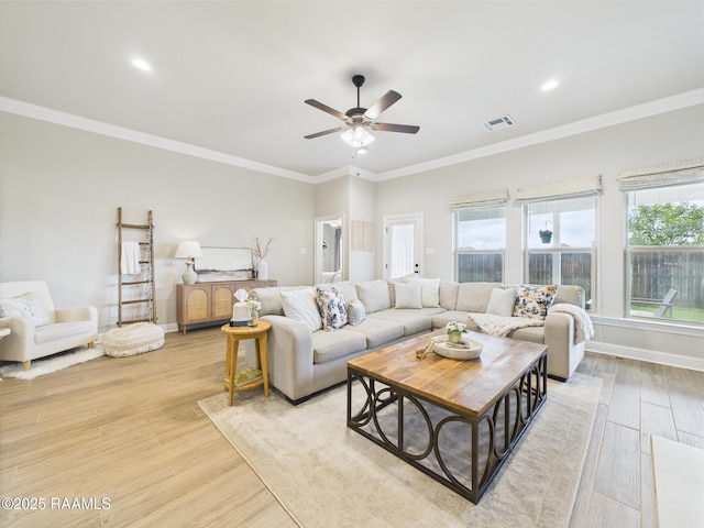 living area with light wood finished floors, a ceiling fan, ornamental molding, recessed lighting, and baseboards