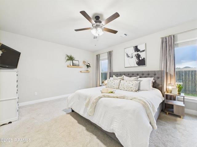 bedroom with carpet floors, baseboards, and a ceiling fan