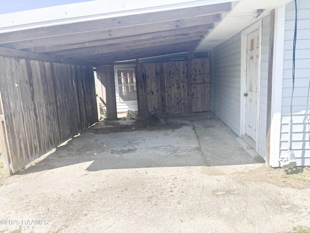 view of vehicle parking featuring a carport